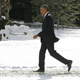 President Barack Obama walks in the snow on the South Lawn of the White House in Washington, January 7, 2015.